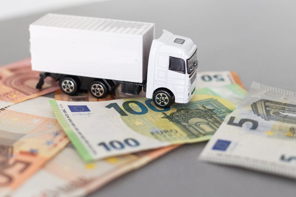 White Toy Truck On Euro Banknotes Concept For Log 2025 01 07 12 23 25 Utc Min